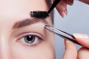 young brunette with short hair woman make-up. girl Cosmetic.